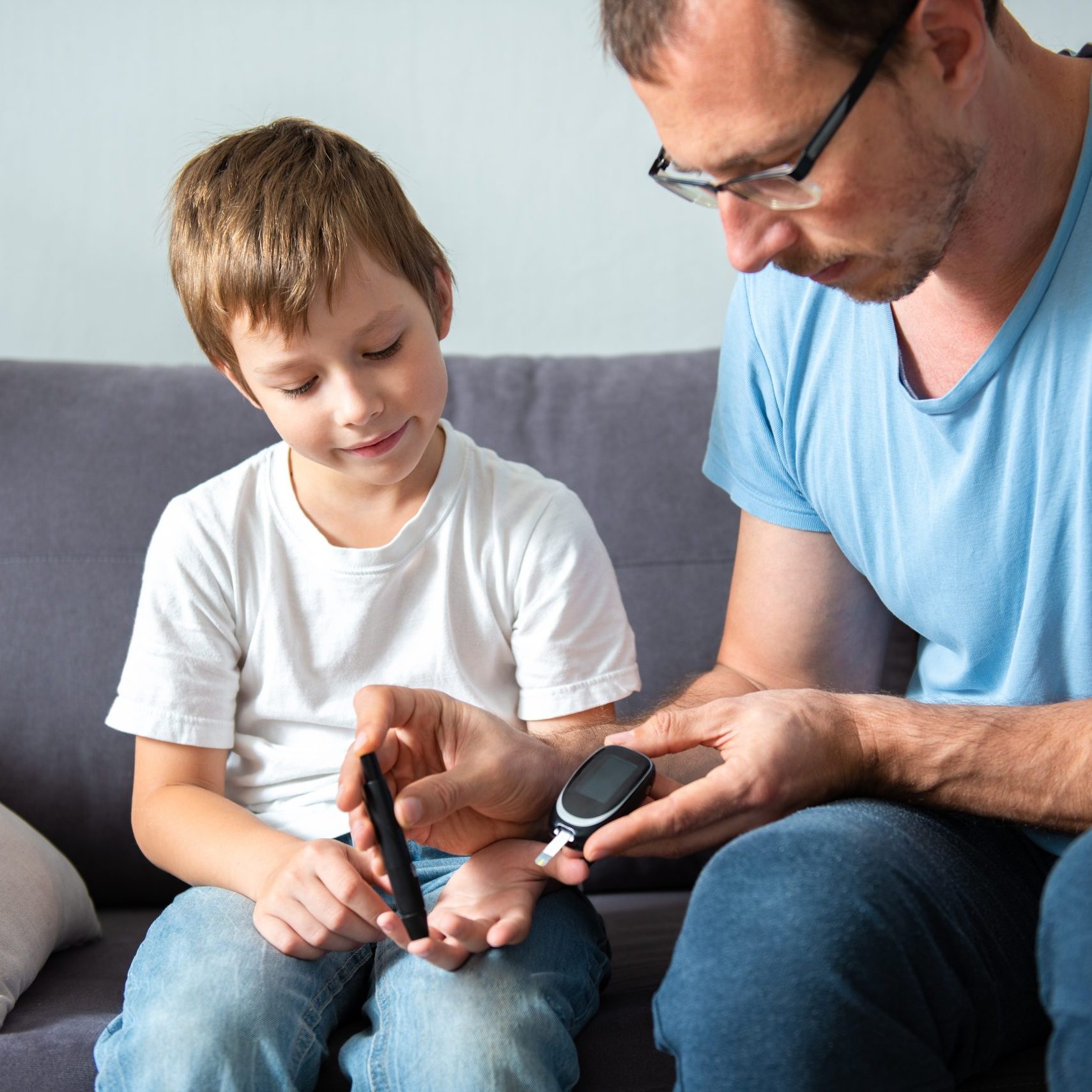 Concept,Children,Diabetes,Children,With,Glucometer,Learning,To,Check,Blood